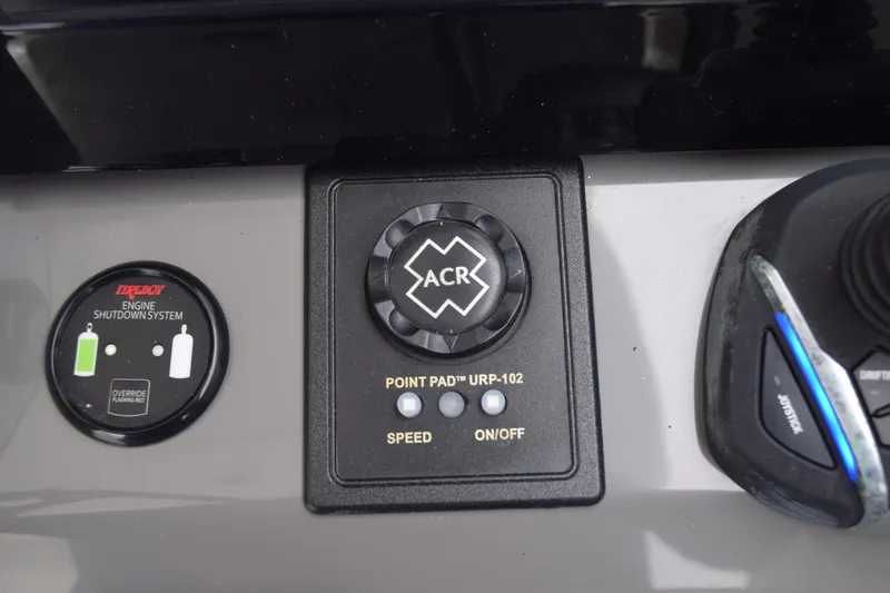 Slide: The Image of 2022 Pursuit OS 355 Offshore boat interior with white seating and control panel. - 317