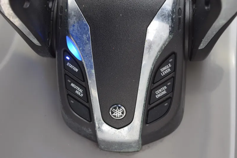 Slide: The Image of 2022 Pursuit OS 355 Offshore cabin entrance with seating and control panel. - 326