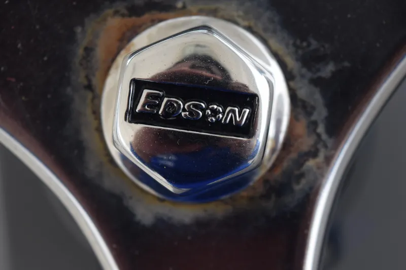 Slide: The Image of 2022 Pursuit OS 355 Offshore boat interior with GPS display and cabin view. - 330