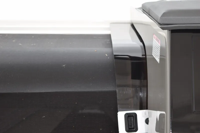 Slide: The Image of Interior view of 2022 Pursuit OS 355 Offshore boat, showcasing cabin entrance and seating area. - 350