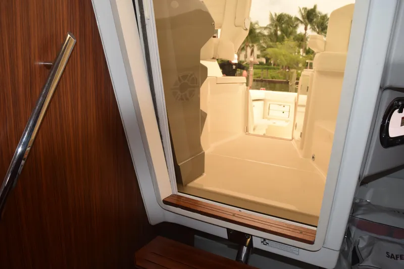 Slide: The Image of Stainless steel GE microwave in 2022 Pursuit OS 355 Offshore boat kitchen. - 386