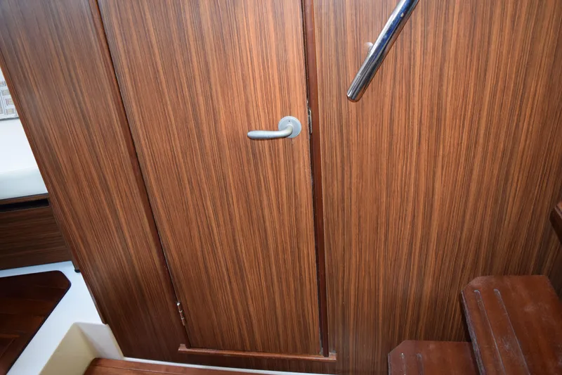 Slide: The Image of Interior of 2022 Pursuit OS 355 Offshore with mounted TV and wood paneling. - 397