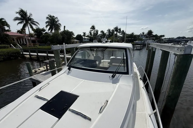 Slide: The Image of Fire extinguisher compartment on 2022 Pursuit OS 355 Offshore boat interior. - 4