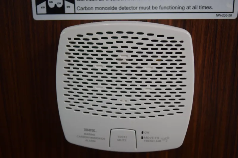 Slide: The Image of 2022 Pursuit OS 355 Offshore cabin interior with wooden flooring and seating area. - 435