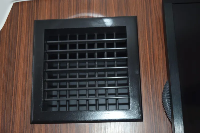 Slide: The Image of Battery compartment of 2022 Pursuit OS 355 Offshore boat, featuring Interstate battery. - 437