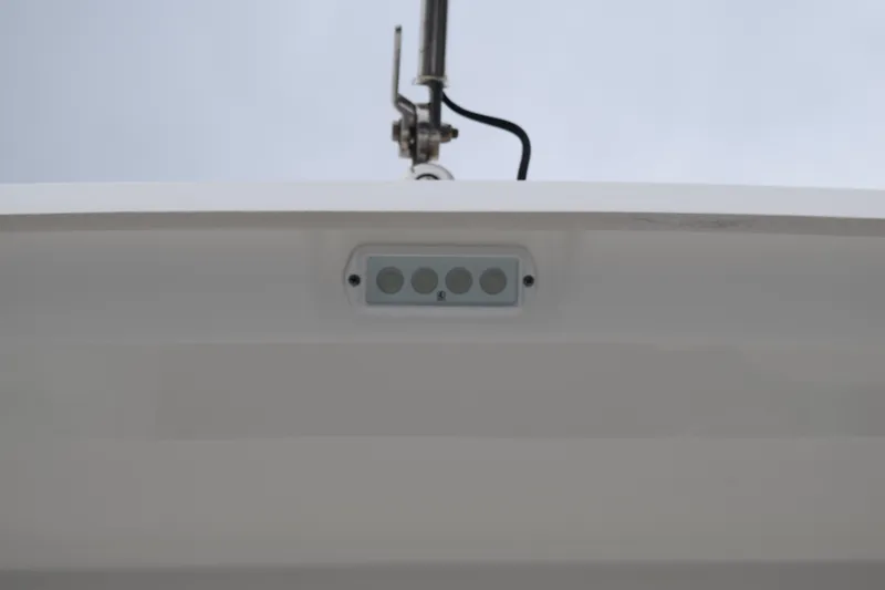 Slide: The Image of 2022 Pursuit OS 355 Offshore boat deck detail with open hatch and water view. - 48