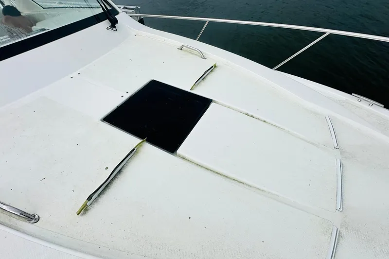 Slide: The Image of Luxurious interior of 2022 Pursuit OS 355 Offshore boat with modern kitchen and seating area. - 5