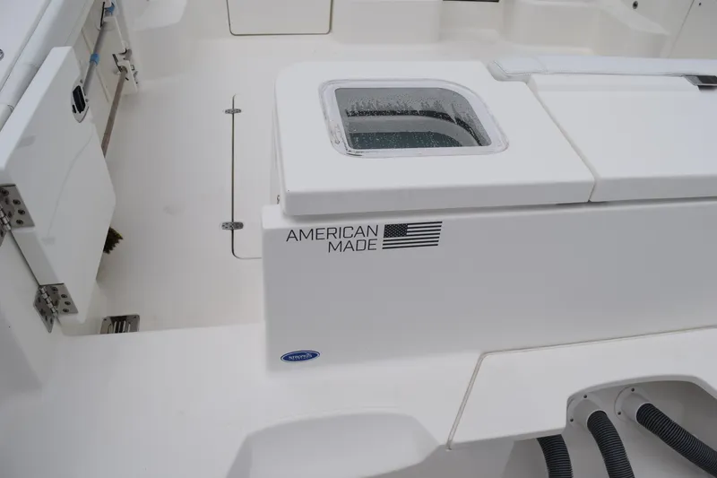 Slide: The Image of 2022 Pursuit OS 355 Offshore boat interior with "American Made" label. - 70