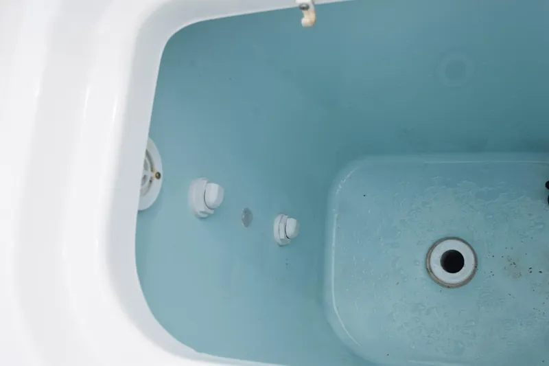 Slide: The Image of Close-up of a 2022 Pursuit OS 355 Offshore boat engine component with Yamaha logo. - 90