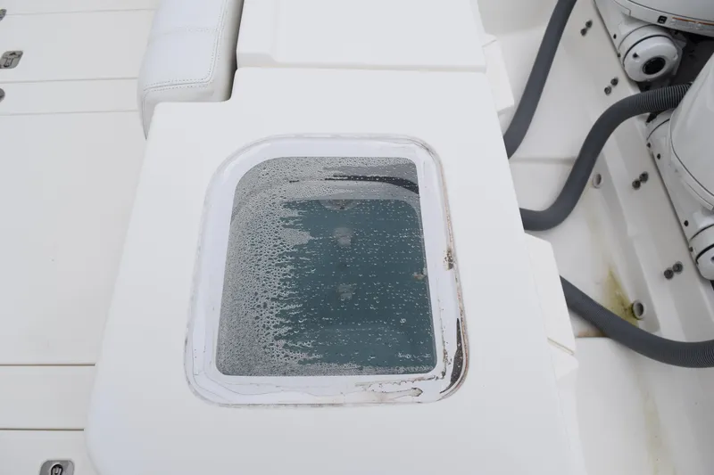 Slide: The Image of 2022 Pursuit OS 355 Offshore boat, fresh water access and warning labels. - 93