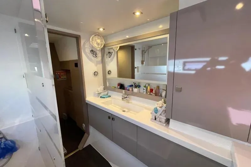 Slide: The Image of Modern bathroom interior of 2022 Fountaine Pajot Astrea 42 catamaran, featuring sleek design. - 10