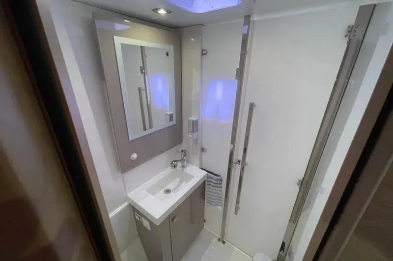 Slide: The Image of Modern bathroom interior of 2022 Fountaine Pajot Astrea 42 yacht, featuring sleek design and amenities. - 12