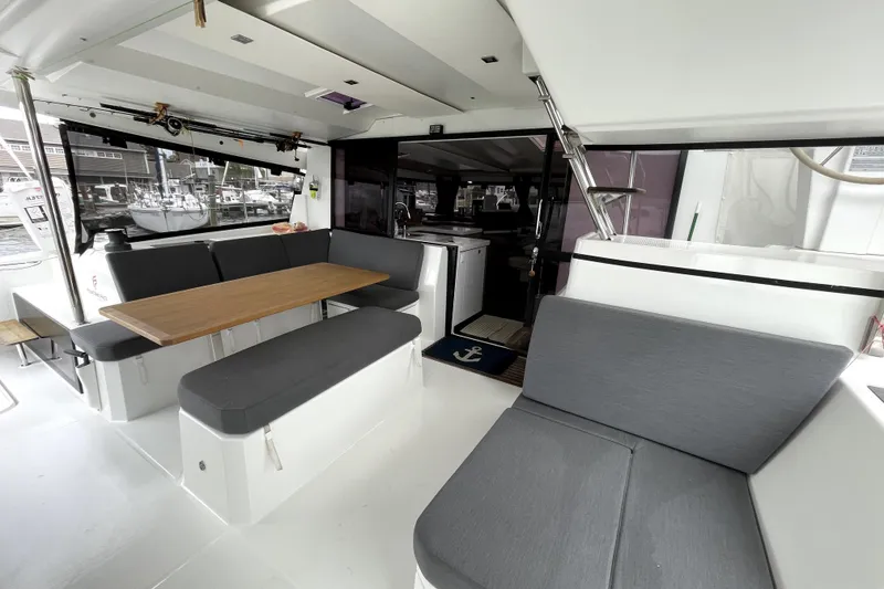 Slide: The Image of Spacious interior of 2022 Fountaine Pajot Astrea 42 catamaran with modern seating and dining area. - 6