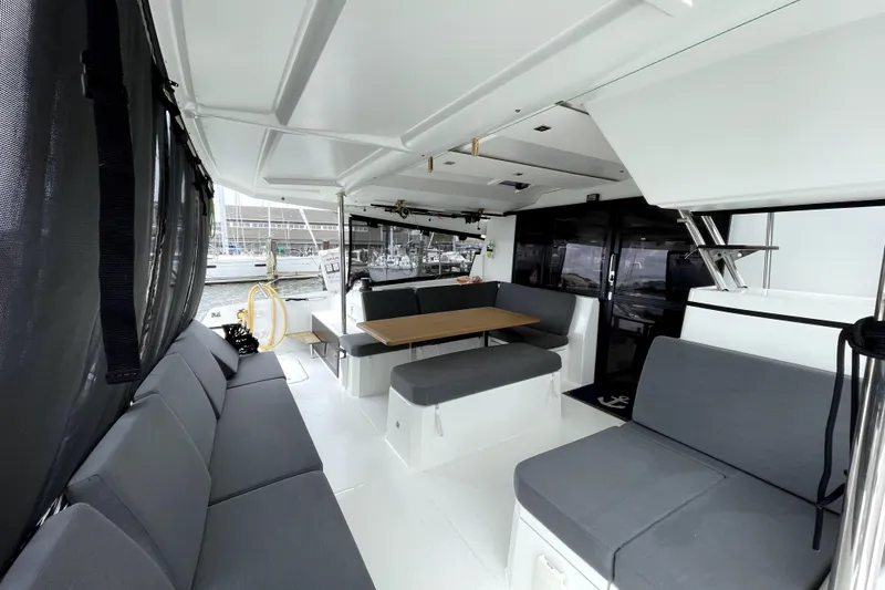 Slide: The Image of Spacious interior of 2022 Fountaine Pajot Astrea 42 catamaran with modern seating and dining area. - 8