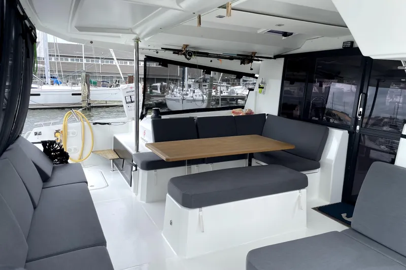 Slide: The Image of Spacious 2022 Fountaine Pajot Astrea 42 yacht interior with comfortable seating and dining area. - 9
