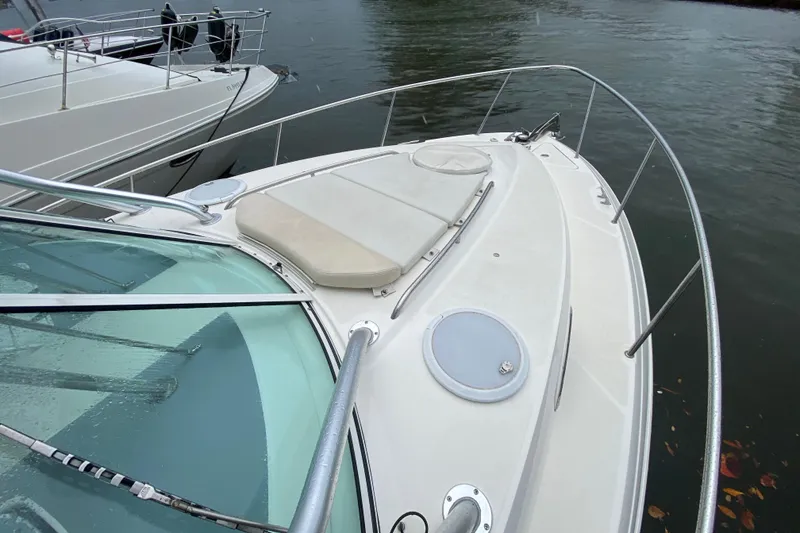 Slide: The Image of 2014 Wellcraft 340 Coastal boat deck with railing, docked on calm water. - 12