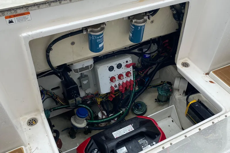 Slide: The Image of Engine compartment of 2014 Wellcraft 340 Coastal boat, showcasing wiring and components. - 26