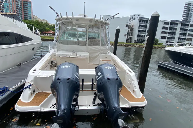 Slide: The Image of 2014 Wellcraft 340 Coastal boat docked with twin Yamaha engines. - 29
