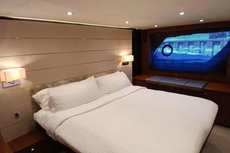 Slide: The Image of Luxurious bedroom interior of 2015 Princess V62-S yacht with modern lighting and large window. - 19
