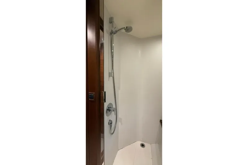 Slide: The Image of Shower area in 2015 Princess V62-S yacht, featuring sleek design and modern fixtures. - 22