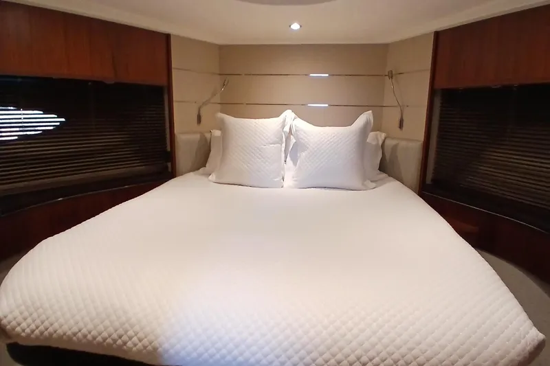 Slide: The Image of Luxurious bedroom interior of 2015 Princess V62-S yacht with elegant bedding. - 23