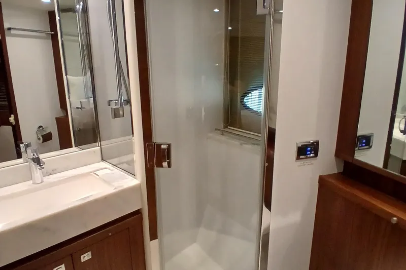 Slide: The Image of Luxurious bathroom in 2015 Princess V62-S yacht with modern shower and sink. - 24