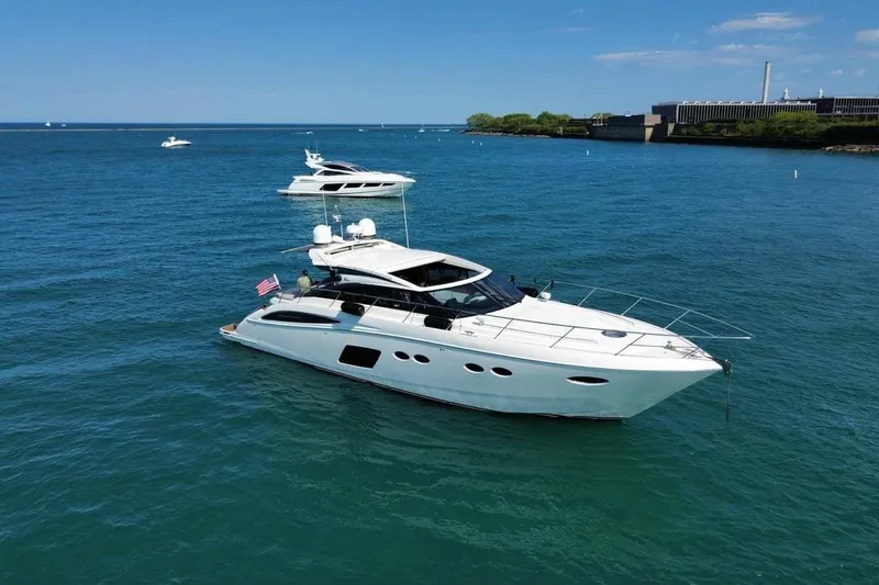 Slide: The Image of 2015 Princess V62-S yacht cruising on clear blue waters under a sunny sky. - 3