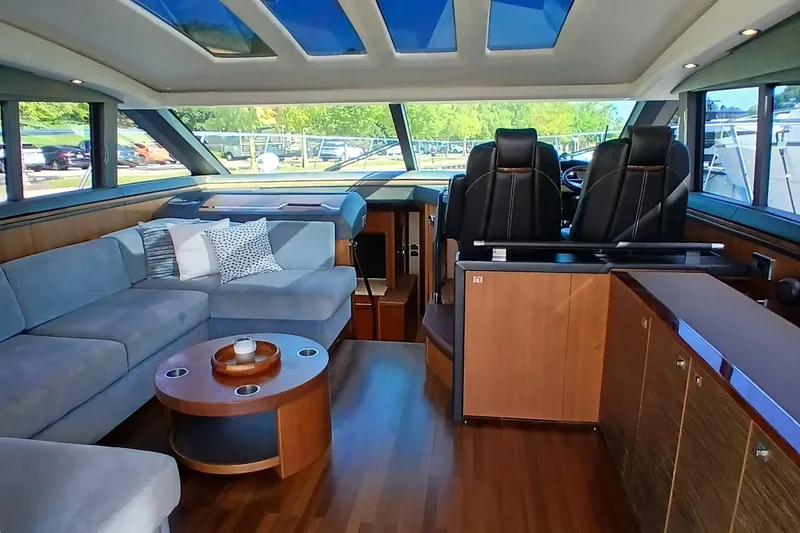 Slide: The Image of Luxurious interior of 2015 Princess V62-S yacht with modern seating and panoramic windows. - 6