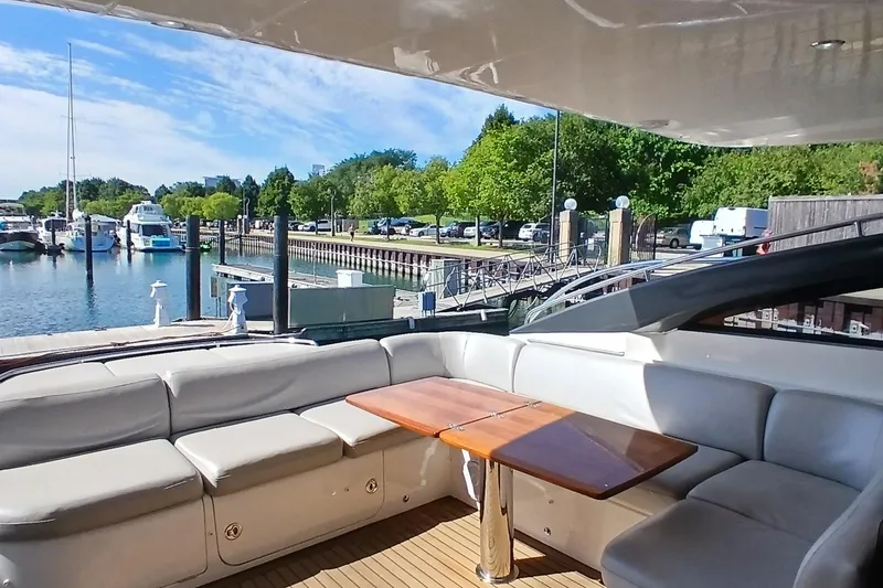 Slide: The Image of Luxurious 2015 Princess V62-S yacht with spacious outdoor seating and elegant interior design. - 10