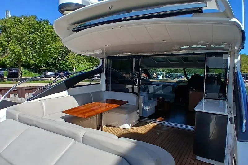 Slide: The Image of Luxurious 2015 Princess V62-S yacht interior with marina view and comfortable seating. - 11