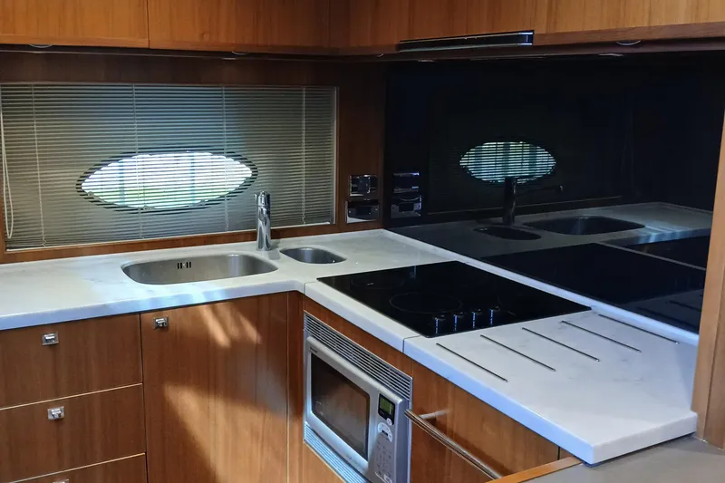 Slide: The Image of Interior of 2015 Princess V62-S yacht with wooden stairs and cozy bedroom. - 14