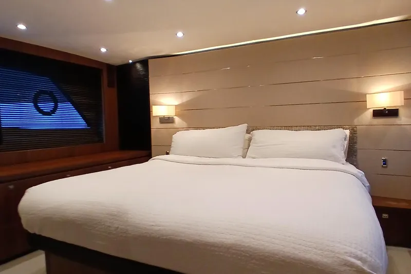 Slide: The Image of Luxurious bedroom interior of 2015 Princess V62-S yacht with modern lighting and large window. - 17