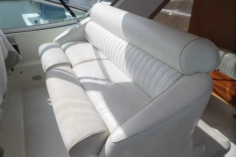 Slide: The Image of 2003 Cruisers Yachts 3275 Express interior with white leather seating. - 13