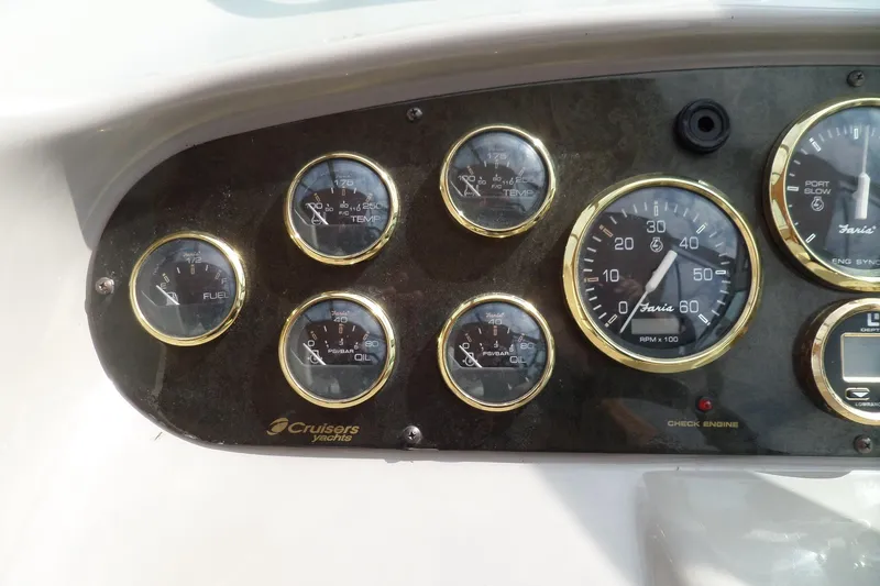 Slide: The Image of Dashboard of 2003 Cruisers Yachts 3275 Express with gauges and controls. - 15