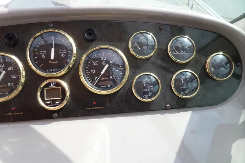 Slide: The Image of Dashboard of 2003 Cruisers Yachts 3275 Express with gauges and controls. - 16