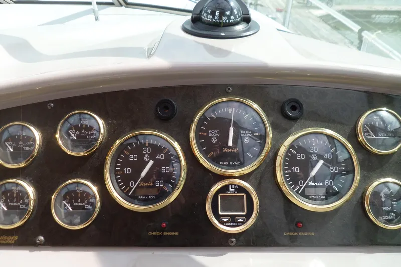 Slide: The Image of Dashboard of 2003 Cruisers Yachts 3275 Express with gauges and compass. - 17