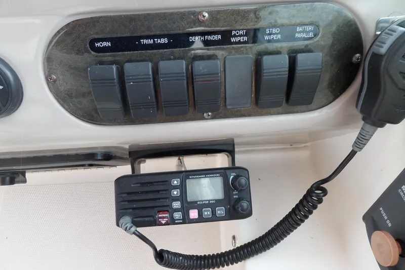 Slide: The Image of Control panel and radio on a 2003 Cruisers Yachts 3275 Express boat. - 20