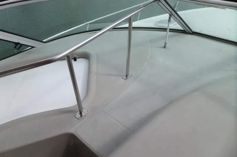 Slide: The Image of 2003 Cruisers Yachts 3275 Express deck with stainless steel railing and windshield. - 28