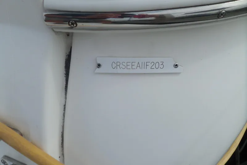 Slide: The Image of 2003 Cruisers Yachts 3275 Express hull identification number on white surface. - 4