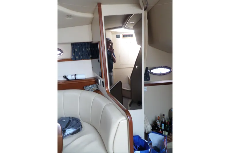 Slide: The Image of Interior of 2003 Cruisers Yachts 3275 Express with seating and storage. - 44