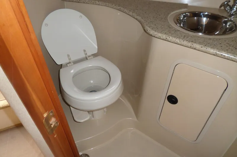 Slide: The Image of 2003 Cruisers Yachts 3275 Express bathroom with toilet and sink. - 48