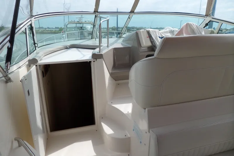 Slide: The Image of 2003 Cruisers Yachts 3275 Express interior with helm and seating area. - 51