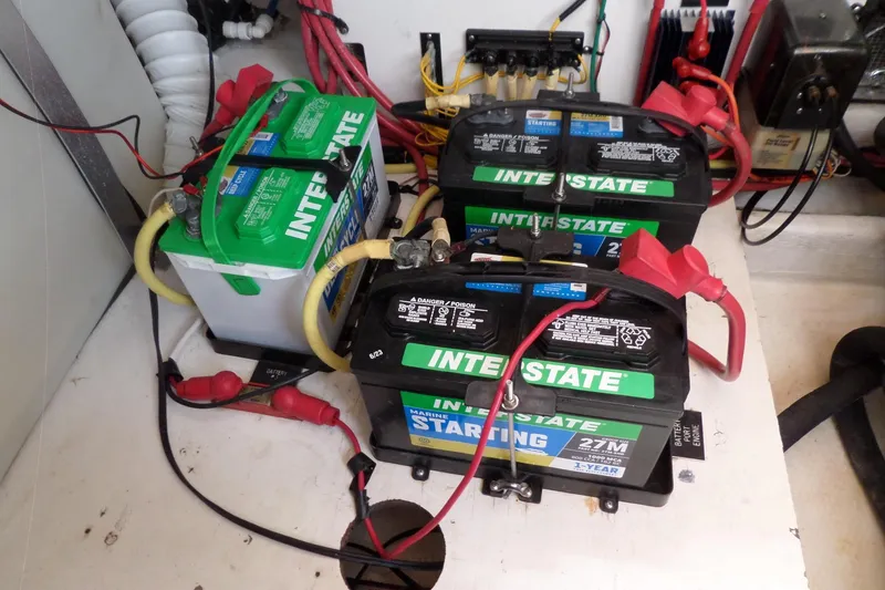 Slide: The Image of Batteries in a 2003 Cruisers Yachts 3275 Express engine compartment. - 55