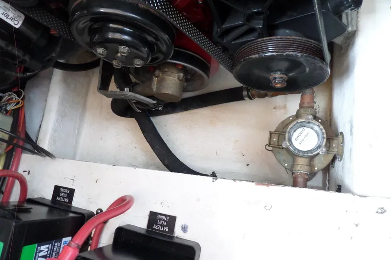 Slide: The Image of Engine compartment of 2003 Cruisers Yachts 3275 Express, showing mechanical components and wiring. - 56