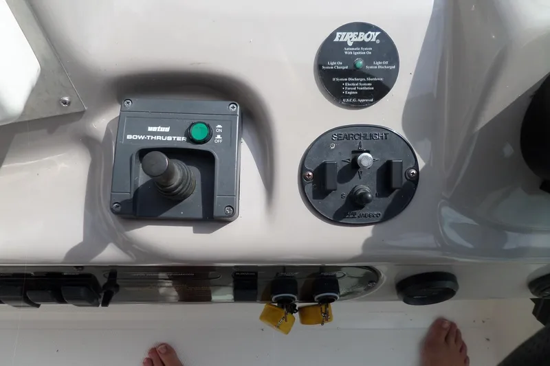 Slide: The Image of Control panel of 2003 Cruisers Yachts 3275 Express with bow thruster and searchlight controls. - 18