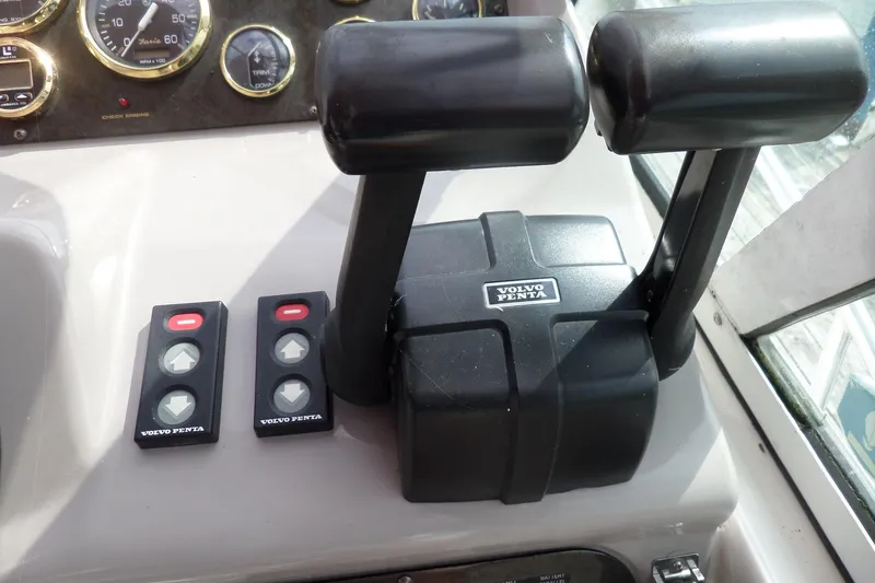 Slide: The Image of Control panel of a 2003 Cruisers Yachts 3275 Express with Volvo Penta throttle. - 19