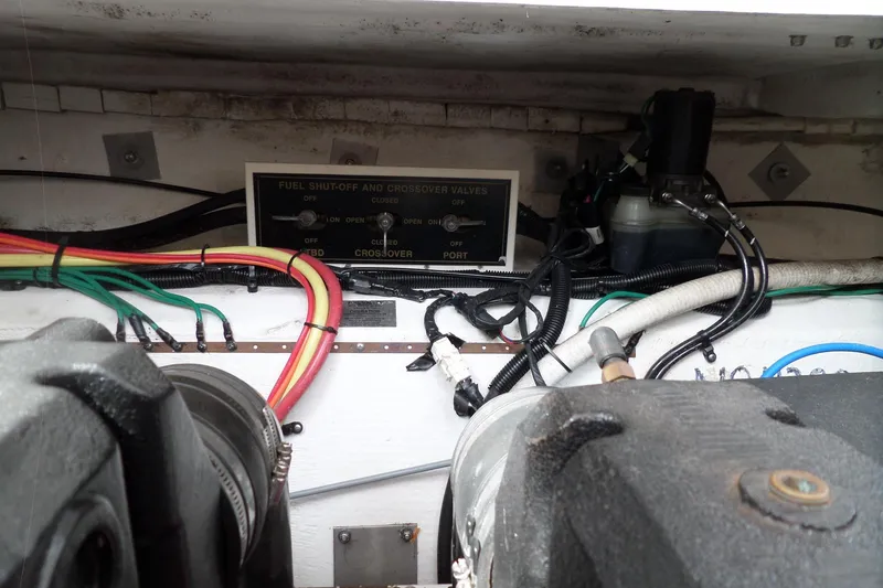 Slide: The Image of Engine compartment of 2003 Cruisers Yachts 3275 Express with fuel shut-off and crossover valves. - 57
