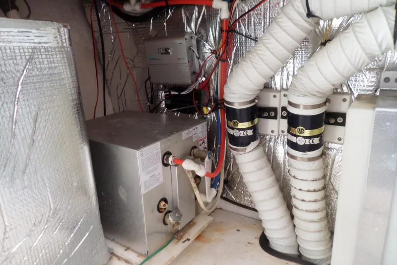Slide: The Image of Engine room of 2003 Cruisers Yachts 3275 Express with wiring and ventilation systems. - 59