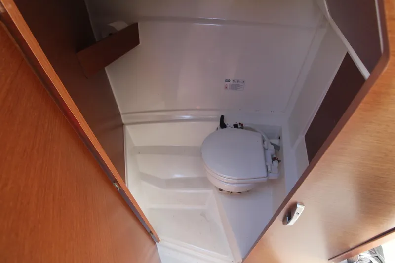 Slide: The Image of 2017 Jeanneau NC Sport 695 boat interior with compact marine toilet. - 20