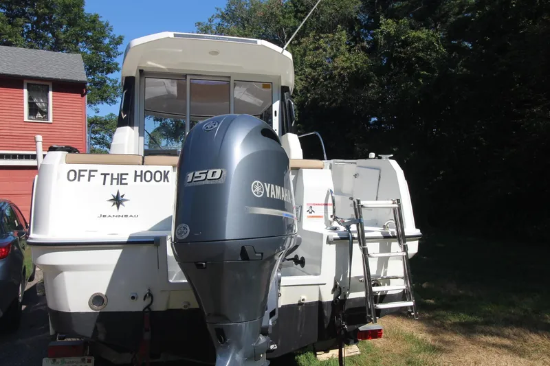 Slide: The Image of 2017 Jeanneau NC Sport 695 boat with Yamaha 150 engine, parked outdoors. - 3